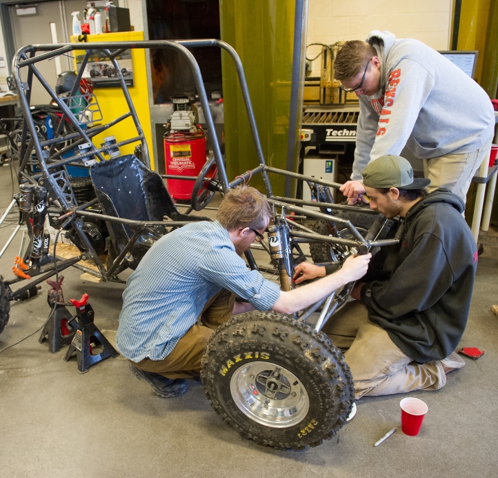 Students working on mini-Baja vehicle